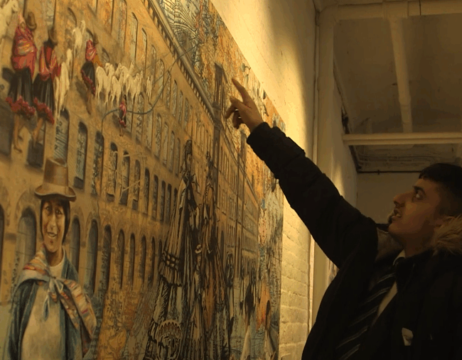 Boy pointing at painting