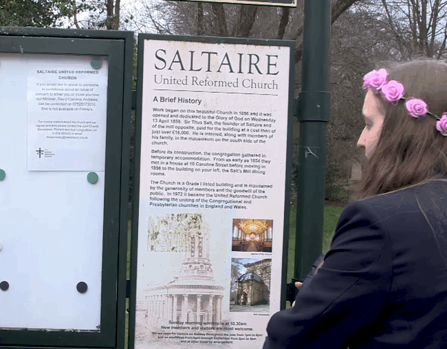 Girl looking at information board